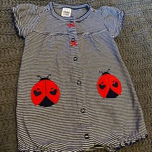 Navy and white striped romper with ladybugs.